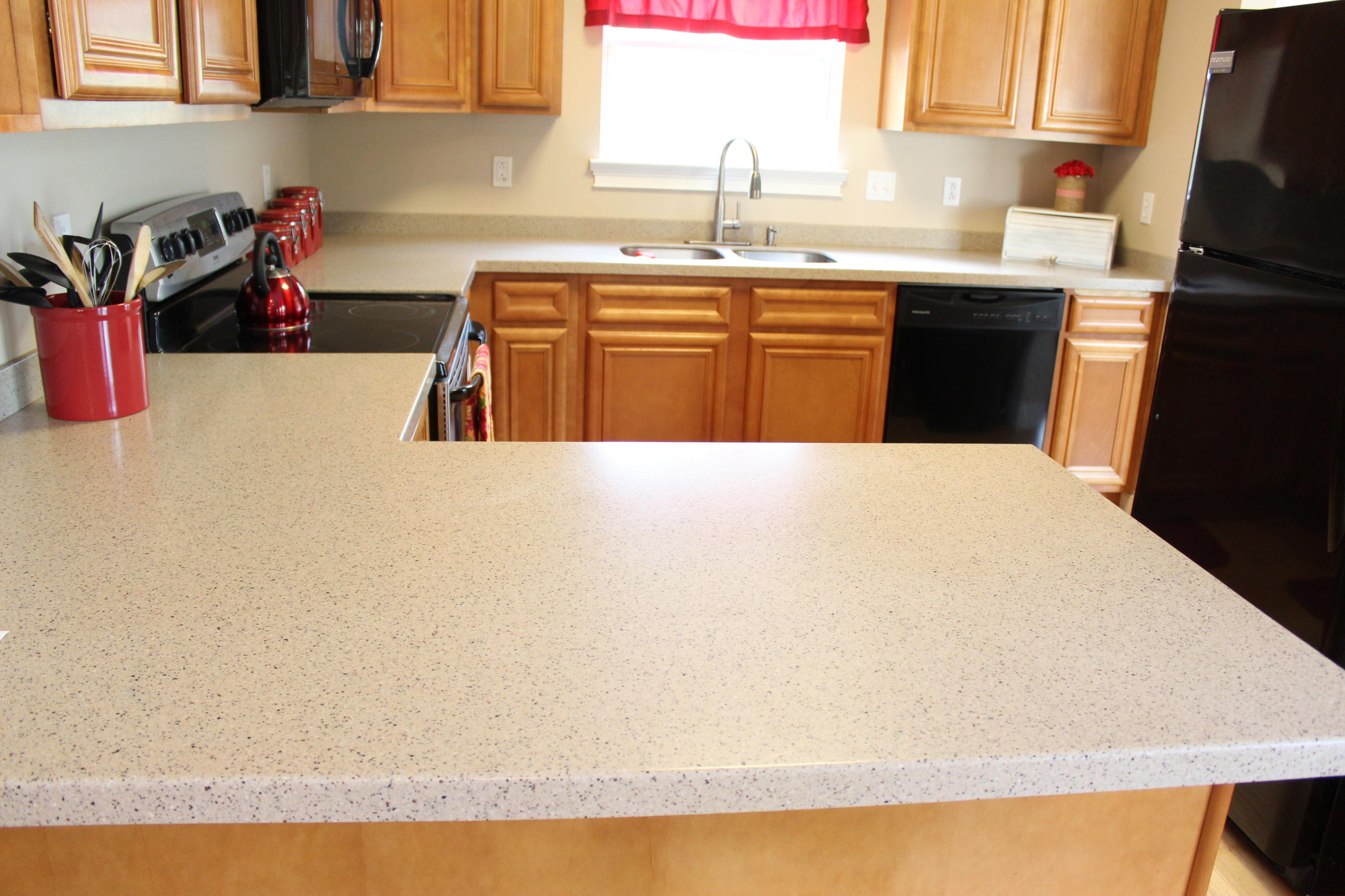 1563 Hinote Road DeFuniak Springs, FL 32433 - Photo 13 of 36 a kitchen with granite countertop a sink dishwasher stove and cabinets