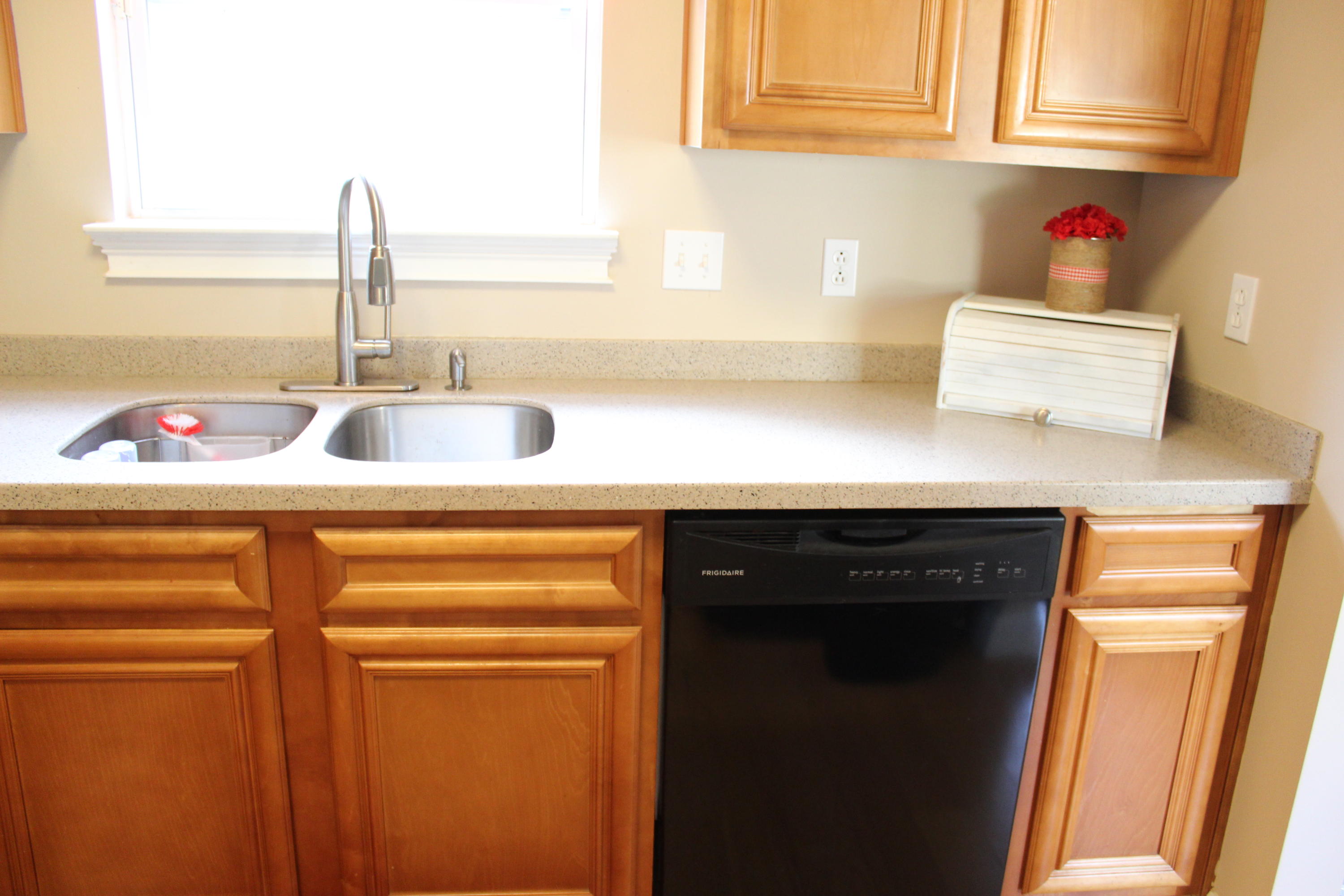 1563 Hinote Road DeFuniak Springs, FL 32433 - Photo 15 of 36 a kitchen with stainless steel appliances a sink and cabinets