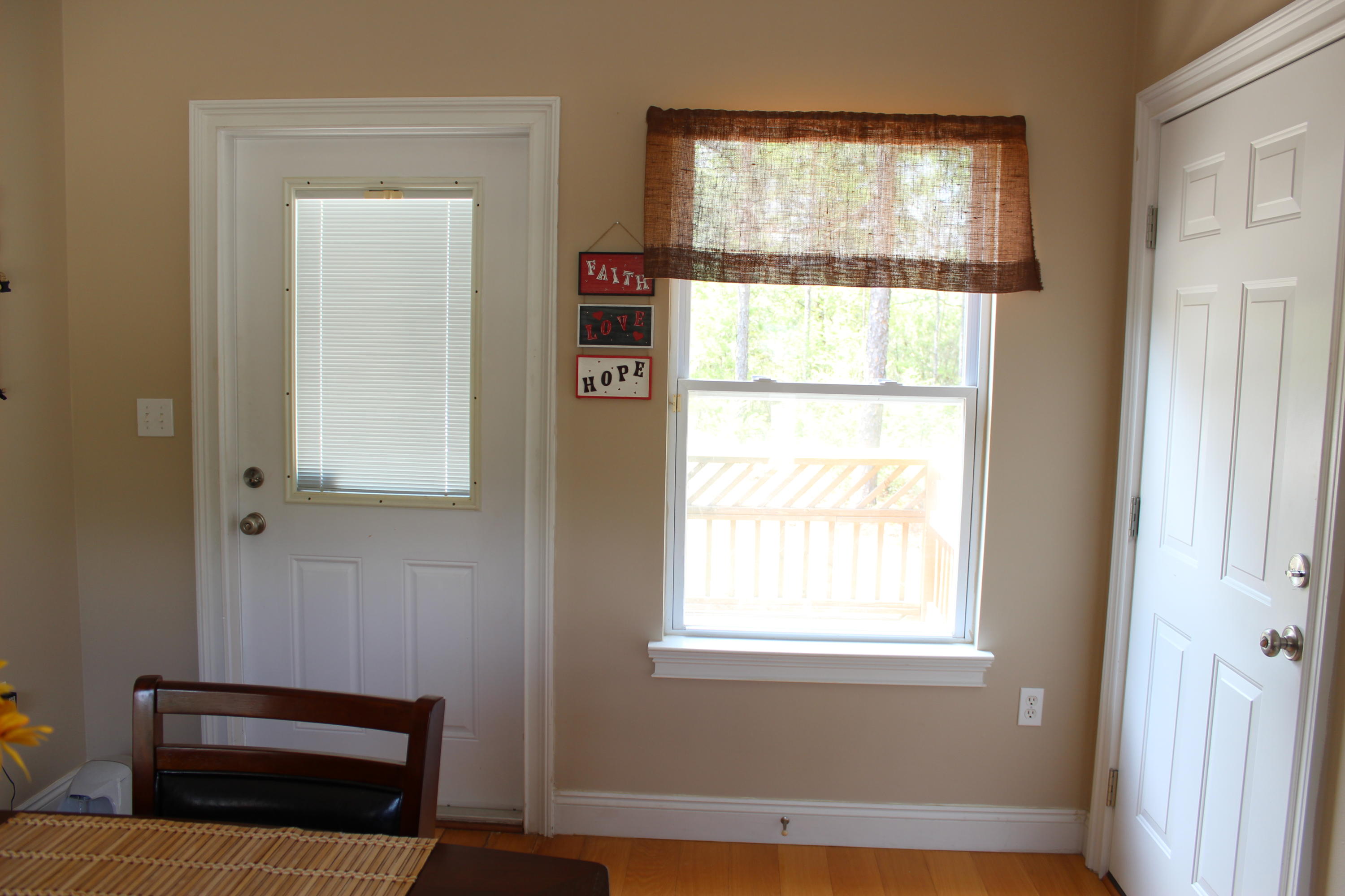 1563 Hinote Road DeFuniak Springs, FL 32433 - Photo 17 of 36 a view of front door with wooden floor