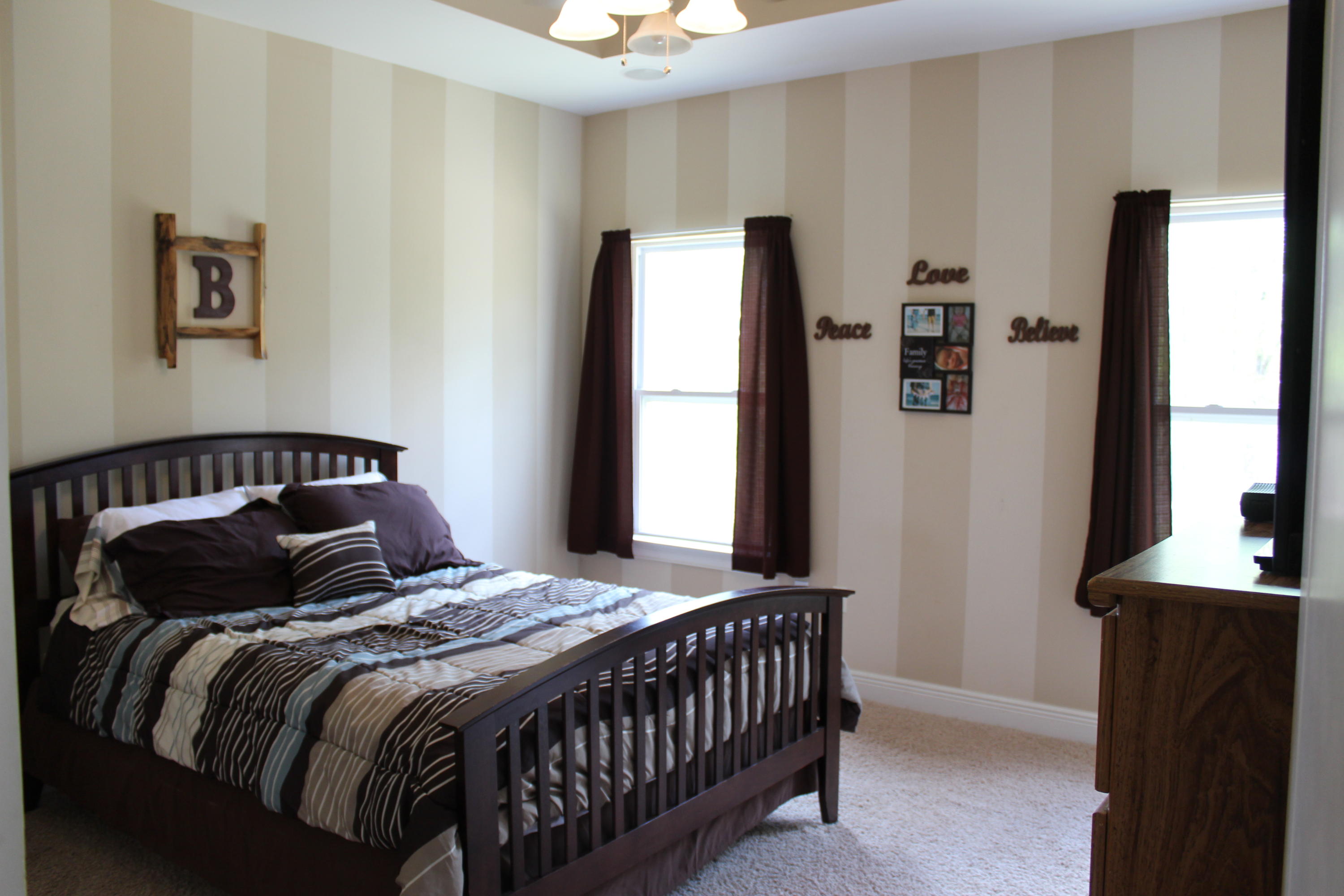 1563 Hinote Road DeFuniak Springs, FL 32433 - Photo 20 of 36 a bedroom with a bed and a window