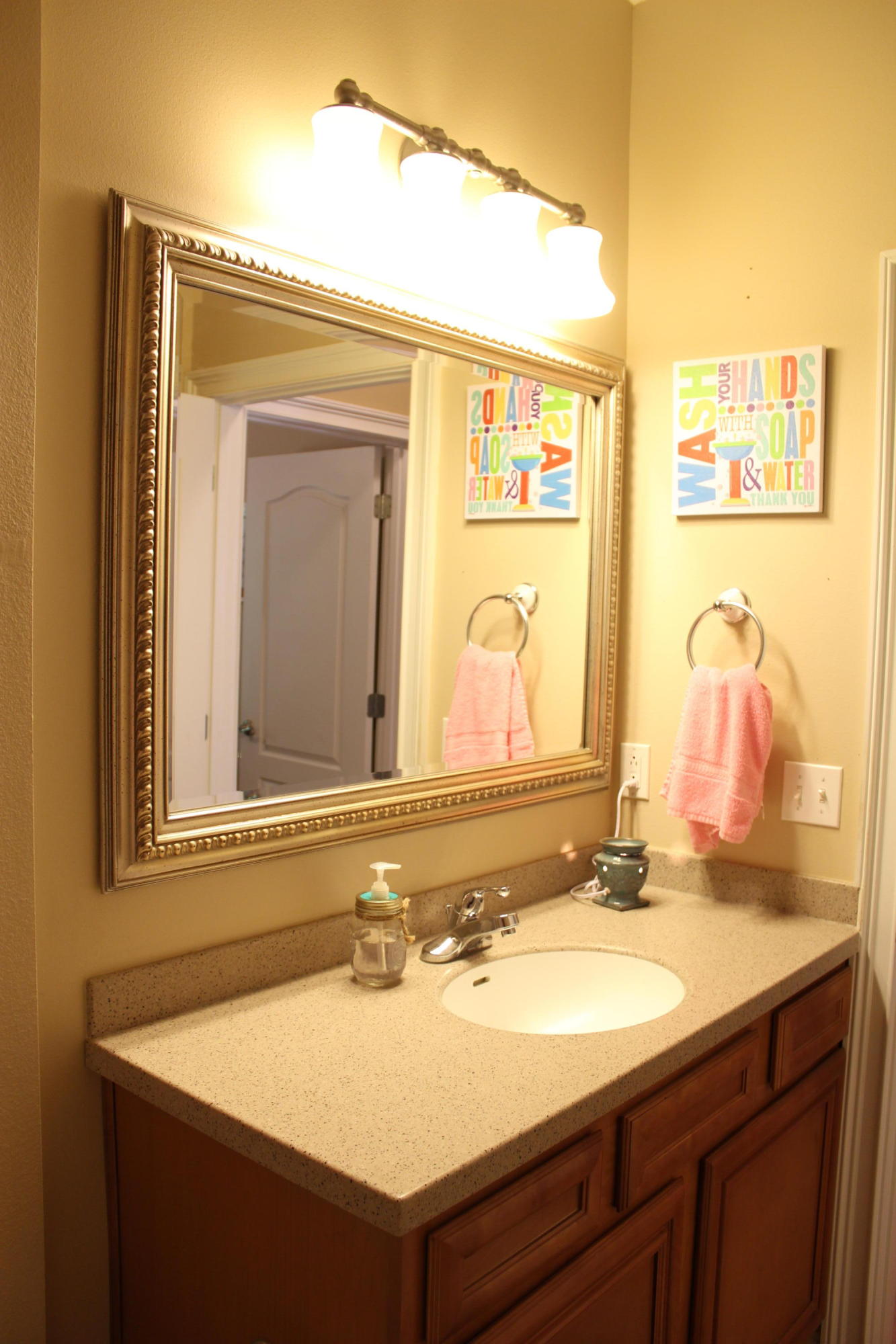 1563 Hinote Road DeFuniak Springs, FL 32433 - Photo 30 of 36 a bathroom with a sink and a mirror
