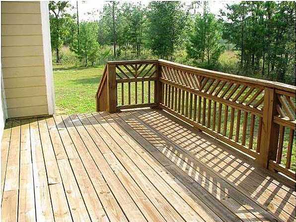 1563 Hinote Road DeFuniak Springs, FL 32433 - Photo 8 of 36 a view of backyard with deck and wooden floor