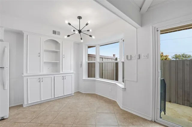 a view of a hallway with a bathroom