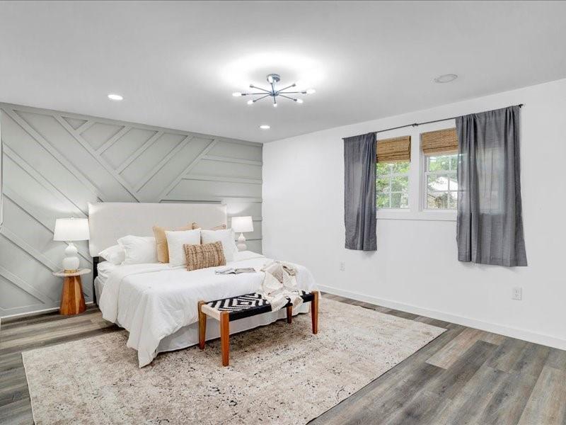 1743 Old Hickory Street Decatur, GA 30032 - Photo 13 of 27 a bedroom with a bed and a chandelier