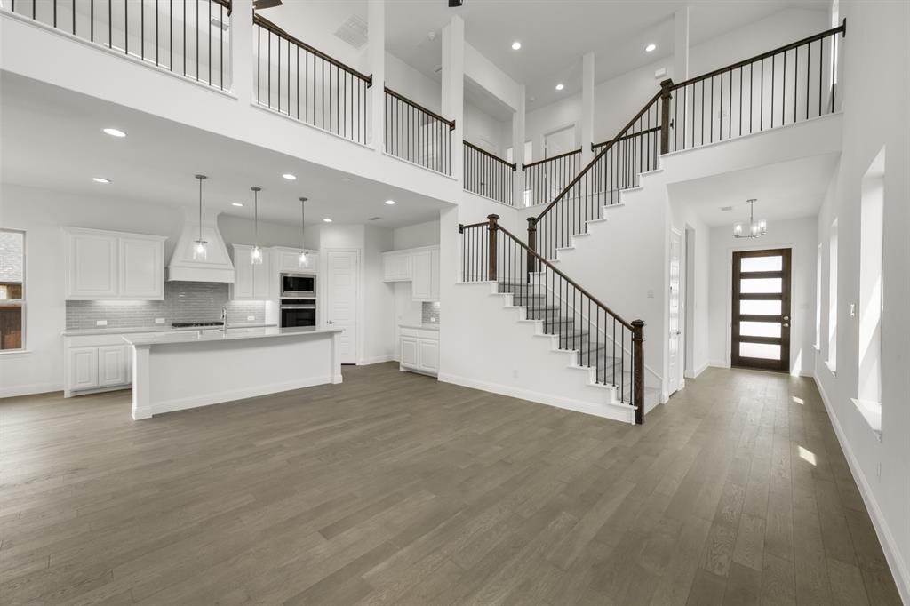 1536 Euclid Alley Corinth, TX 76208 - Photo 10 of 35 a view of kitchen with kitchen island wooden floor center island and stainless steel appliances