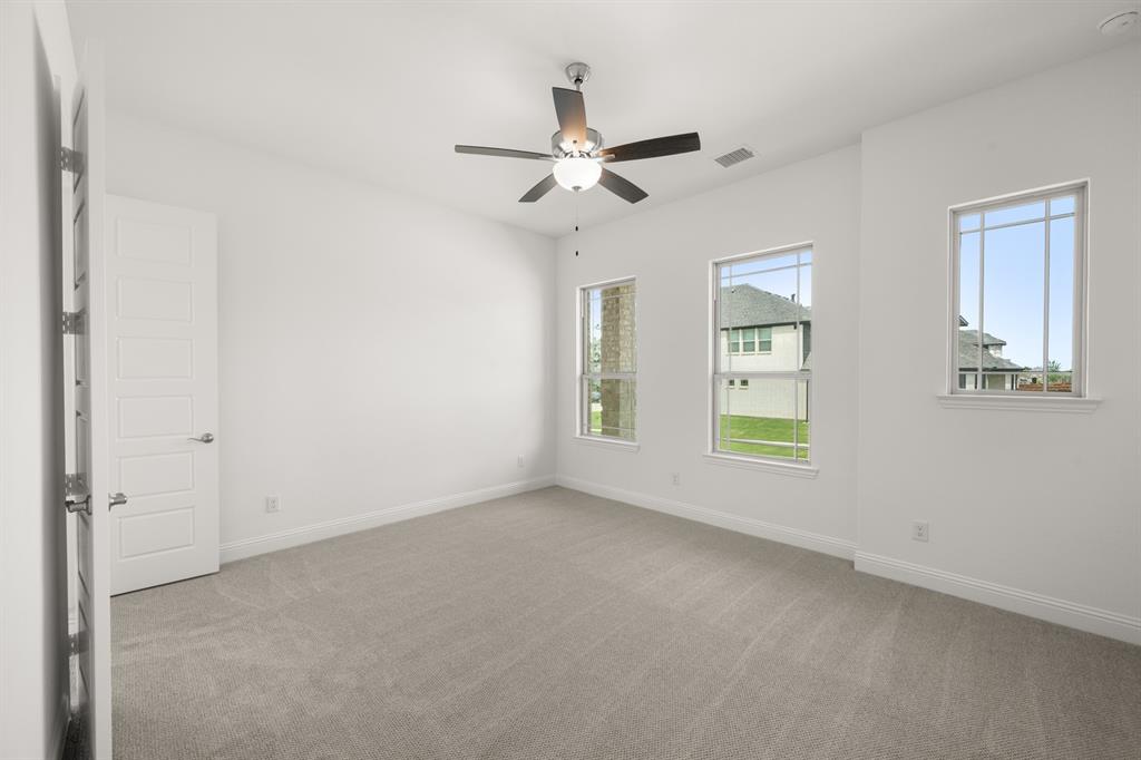 1536 Euclid Alley Corinth, TX 76208 - Photo 19 of 35 a view of an empty room with a window