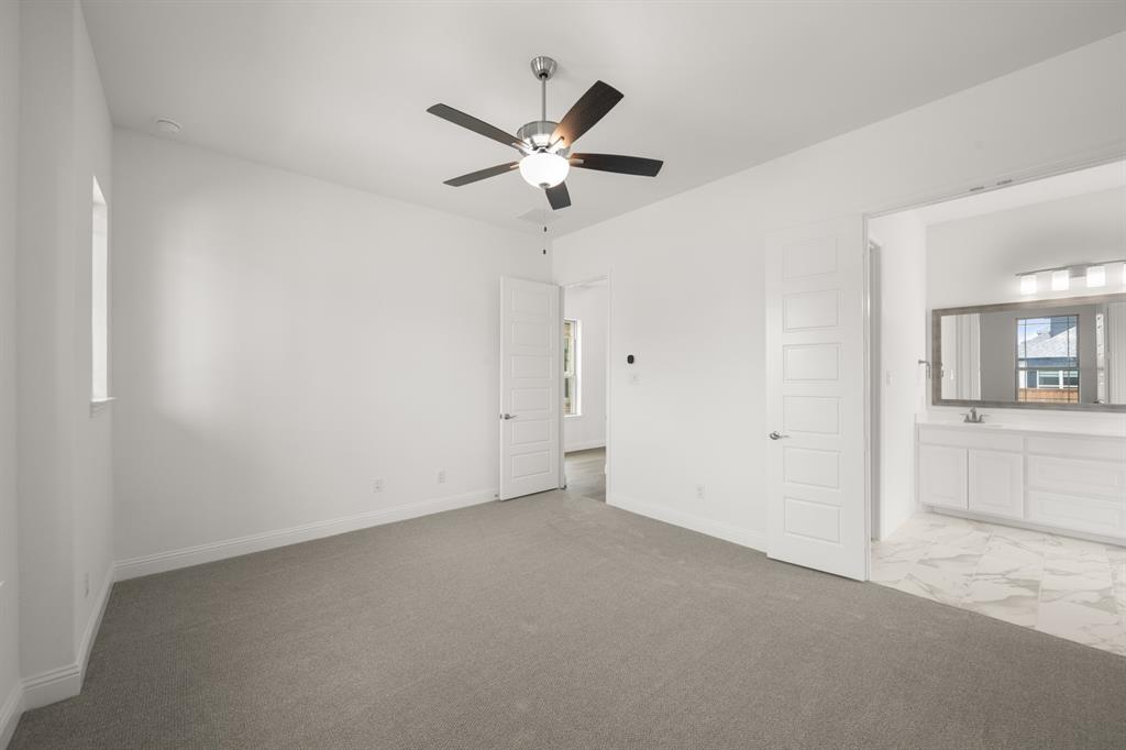 1536 Euclid Alley Corinth, TX 76208 - Photo 20 of 35 a view of a livingroom with a ceiling fan and window