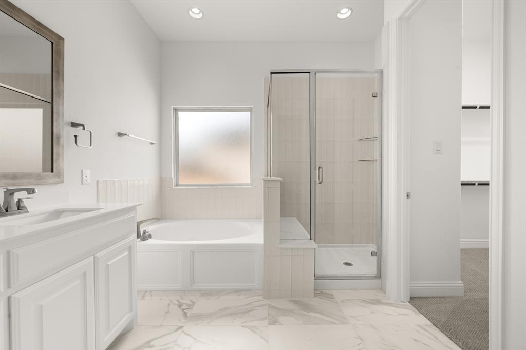 1536 Euclid Alley Corinth, TX 76208 - Photo 24 of 35 a bathroom with a tub a toilet and a sink