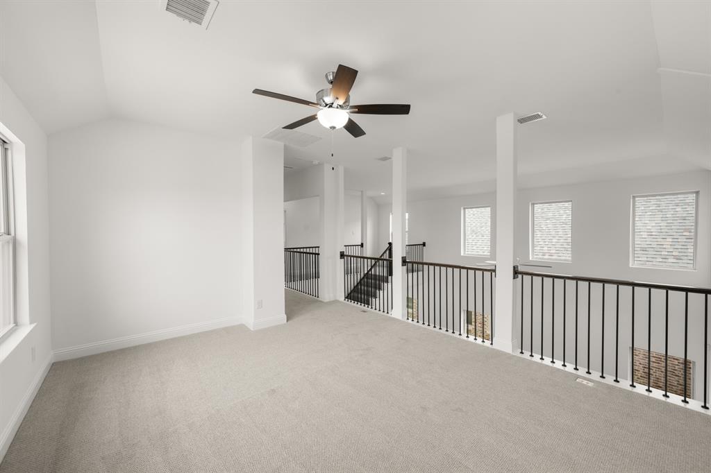1536 Euclid Alley Corinth, TX 76208 - Photo 27 of 35 a view of a hallway with carpet