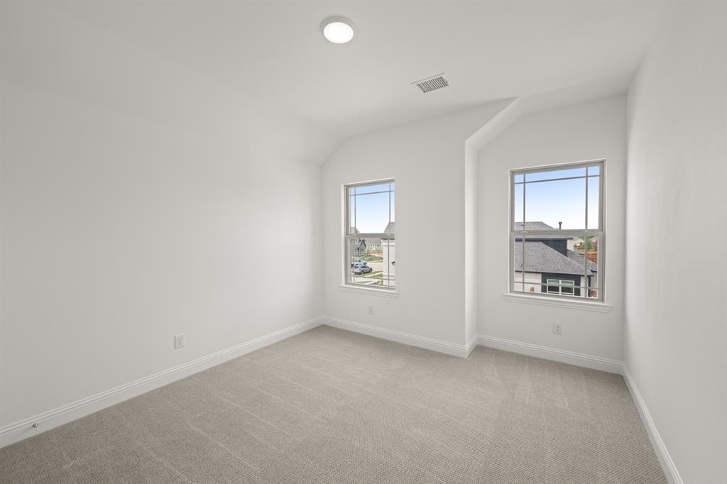 1536 Euclid Alley Corinth, TX 76208 - Photo 28 of 35 an empty room with windows and closet