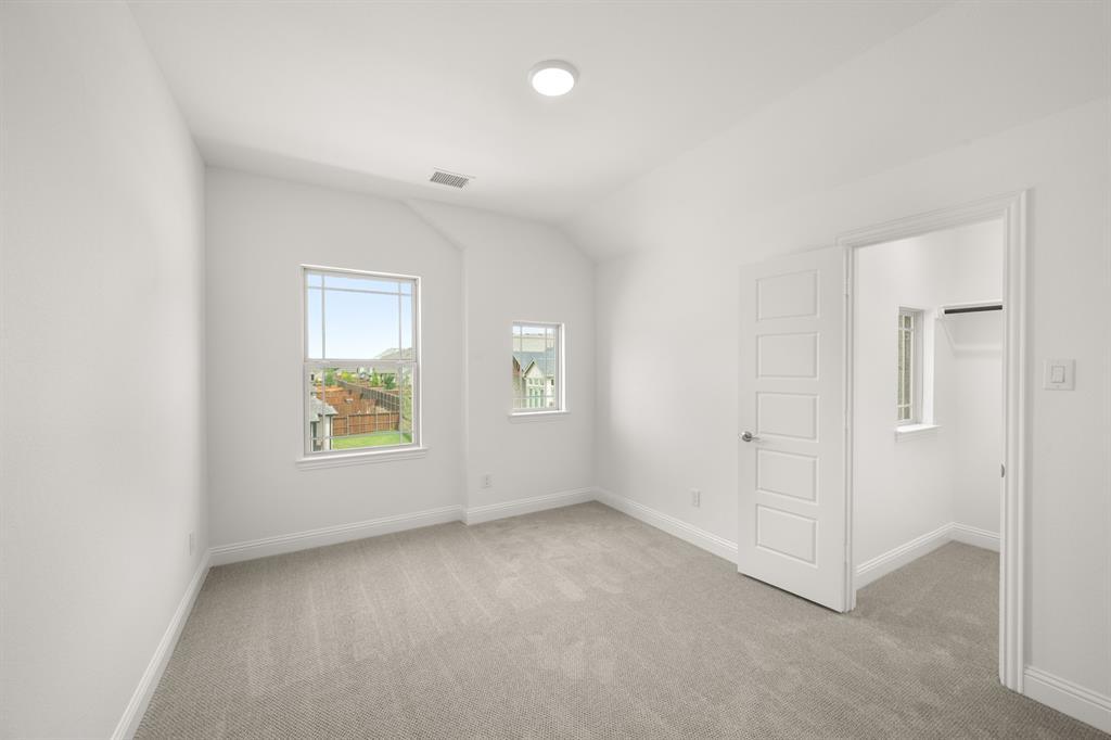 1536 Euclid Alley Corinth, TX 76208 - Photo 29 of 35 an empty room with windows and closet