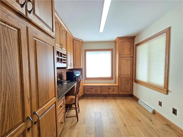 a view of entryway with wooden floor and stairs