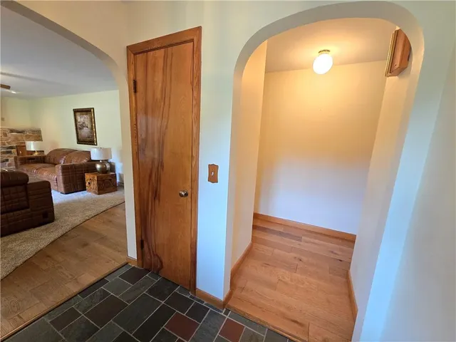 a view of a hallway with living room