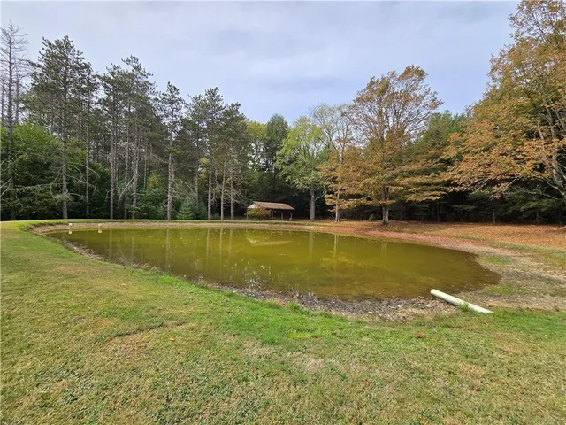 a view of a swimming pool with an outdoor space and seating area