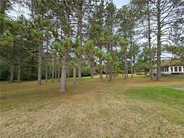 a view of outdoor space with deck and trees