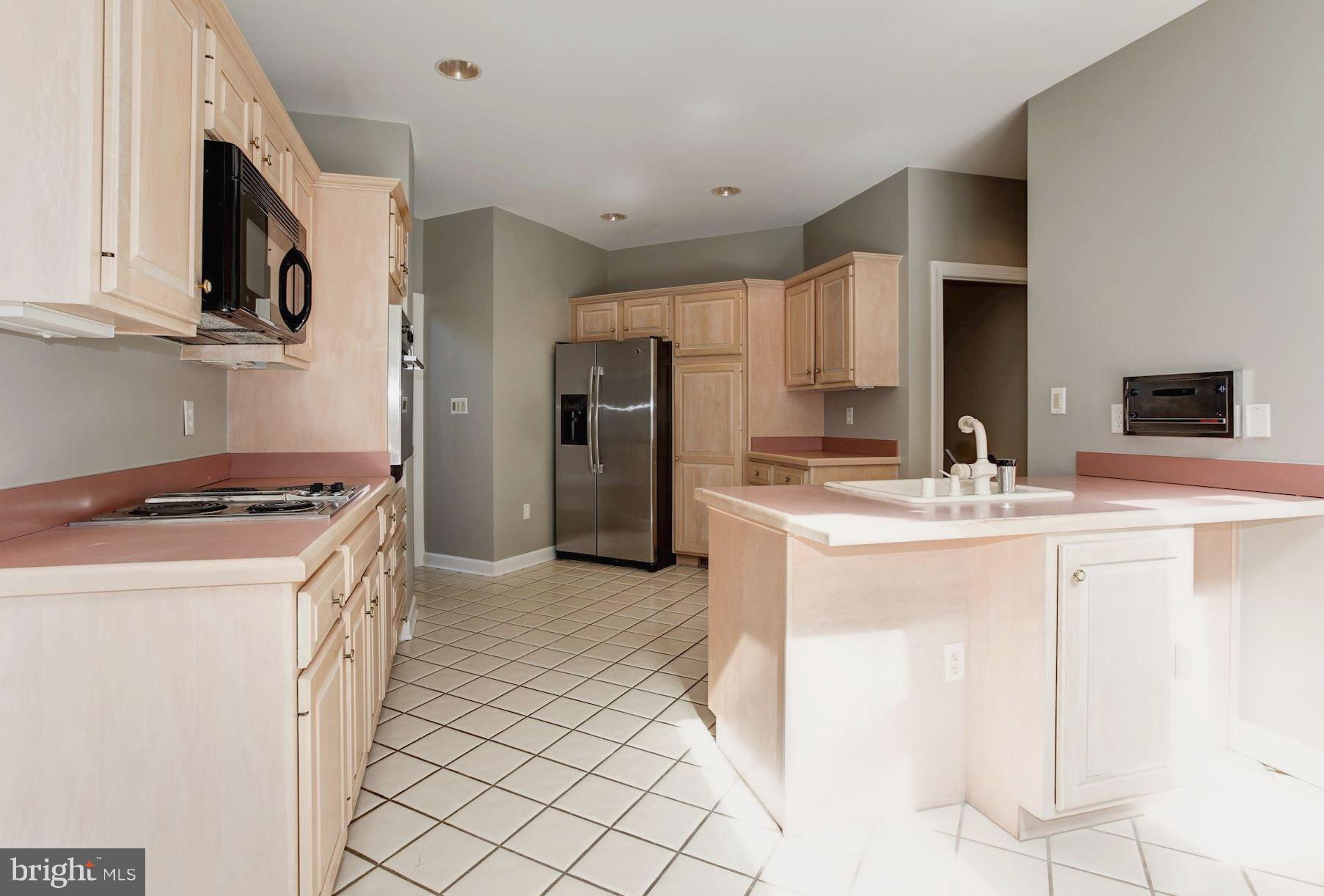 130 South River Landing Road Edgewater, MD 21037 - Photo 15 of 30 Tile Floored Gourmet Kitchen with Custom Cabinetry