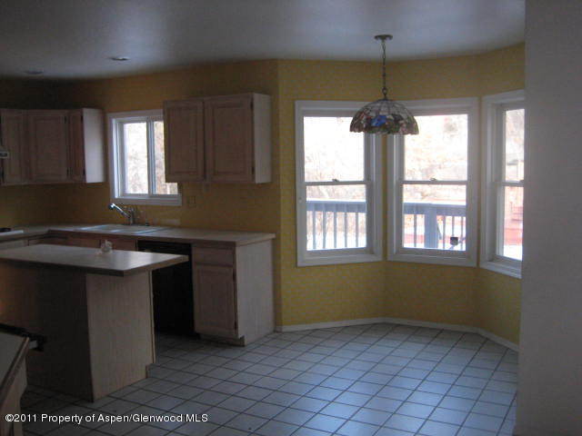 330 Riverside Drive Basalt, CO 81621 - Photo 5 of 9 a kitchen with a sink cabinets and window