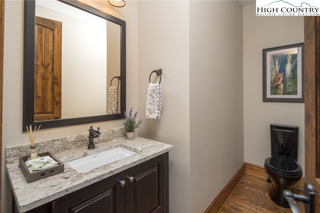 331 Goldenrod Road Boone, NC 28607 - Photo 14 of 50 a bathroom with a granite countertop sink and a mirror