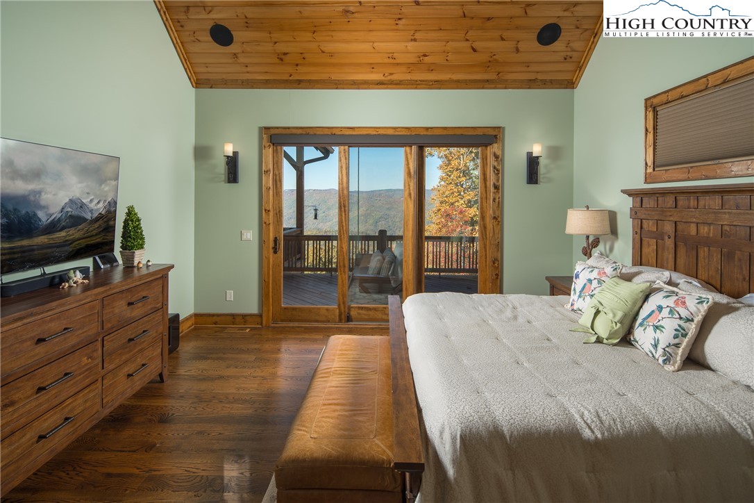 331 Goldenrod Road Boone, NC 28607 - Photo 16 of 50 a bedroom with a bed and a flat screen tv