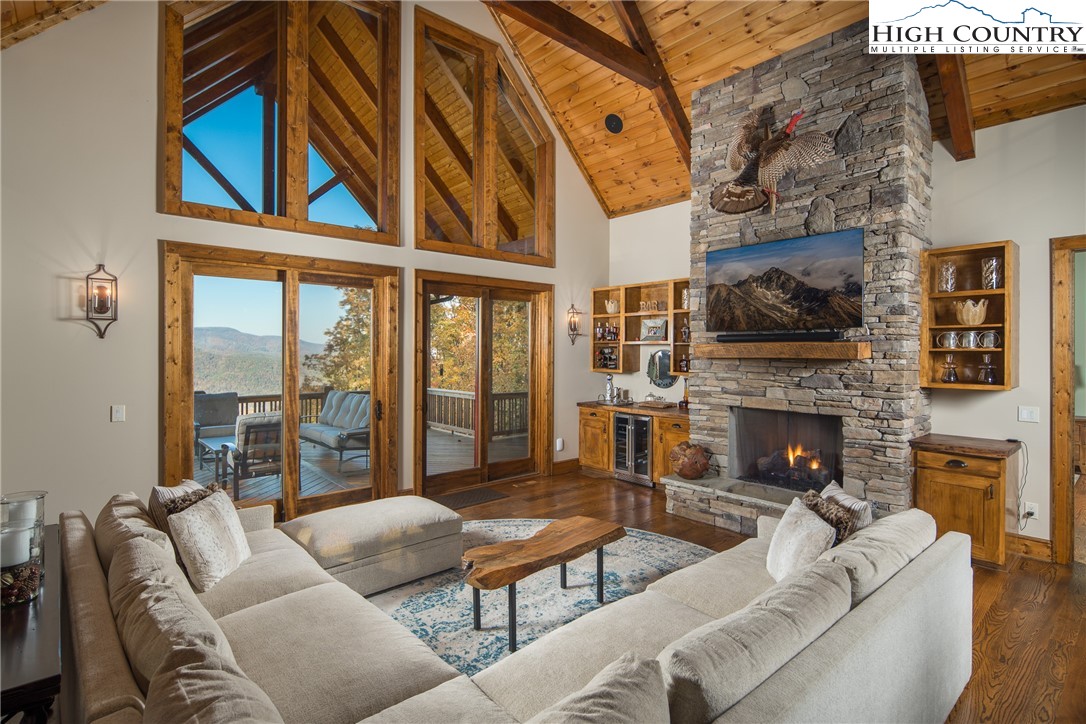 331 Goldenrod Road Boone, NC 28607 - Photo 2 of 50 a living room with furniture a fireplace and a flat screen tv