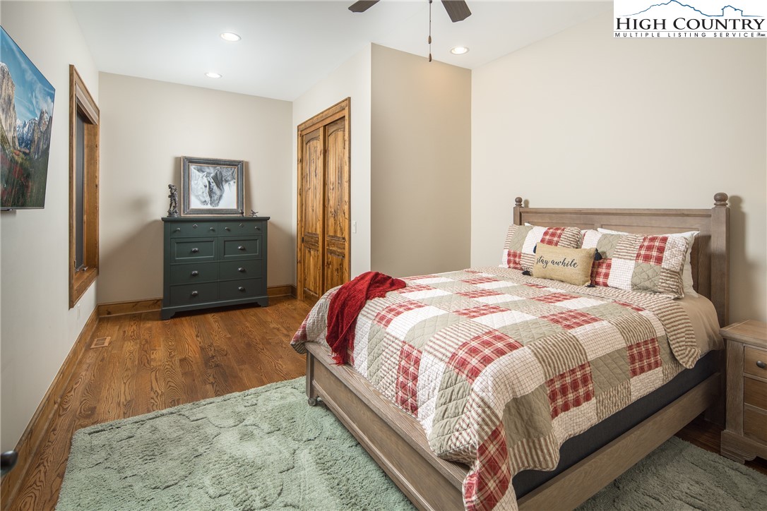 331 Goldenrod Road Boone, NC 28607 - Photo 36 of 50 a large bed sitting in a bedroom and a table