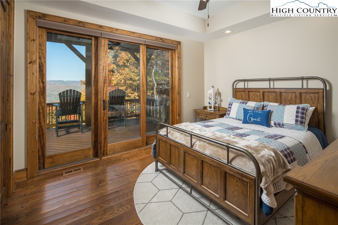 331 Goldenrod Road Boone, NC 28607 - Photo 37 of 50 a bedroom with a bed and a mirror