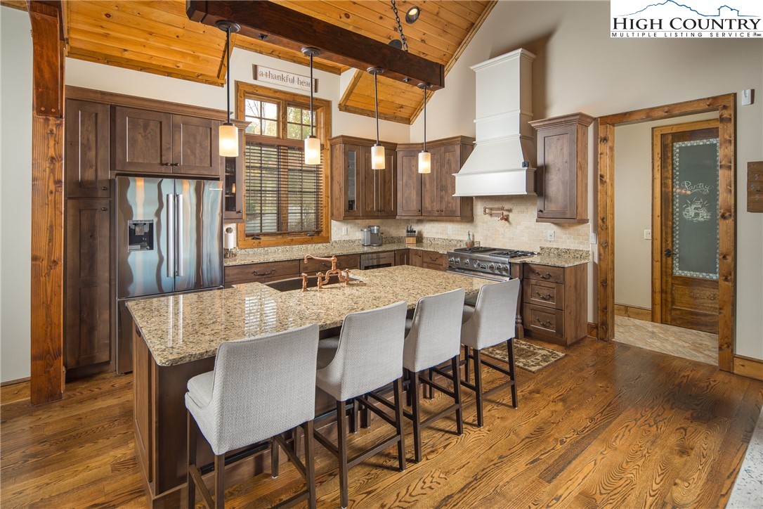 331 Goldenrod Road Boone, NC 28607 - Photo 8 of 50 a dining table with chairs and wooden floor