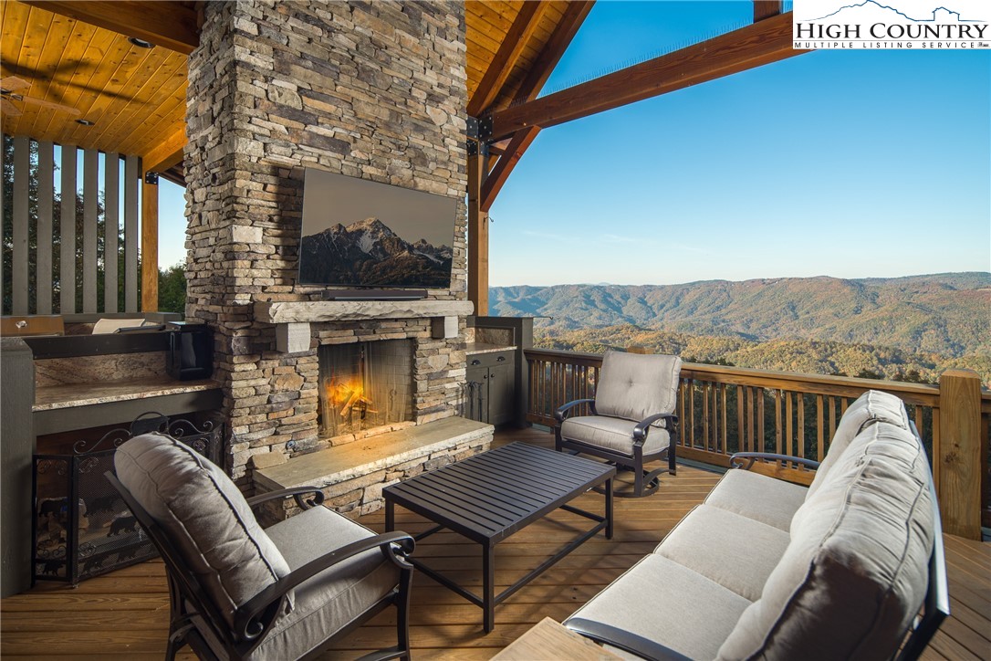 331 Goldenrod Road Boone, NC 28607 - Photo 10 of 50 a view of a terrace with furniture and a fire pit