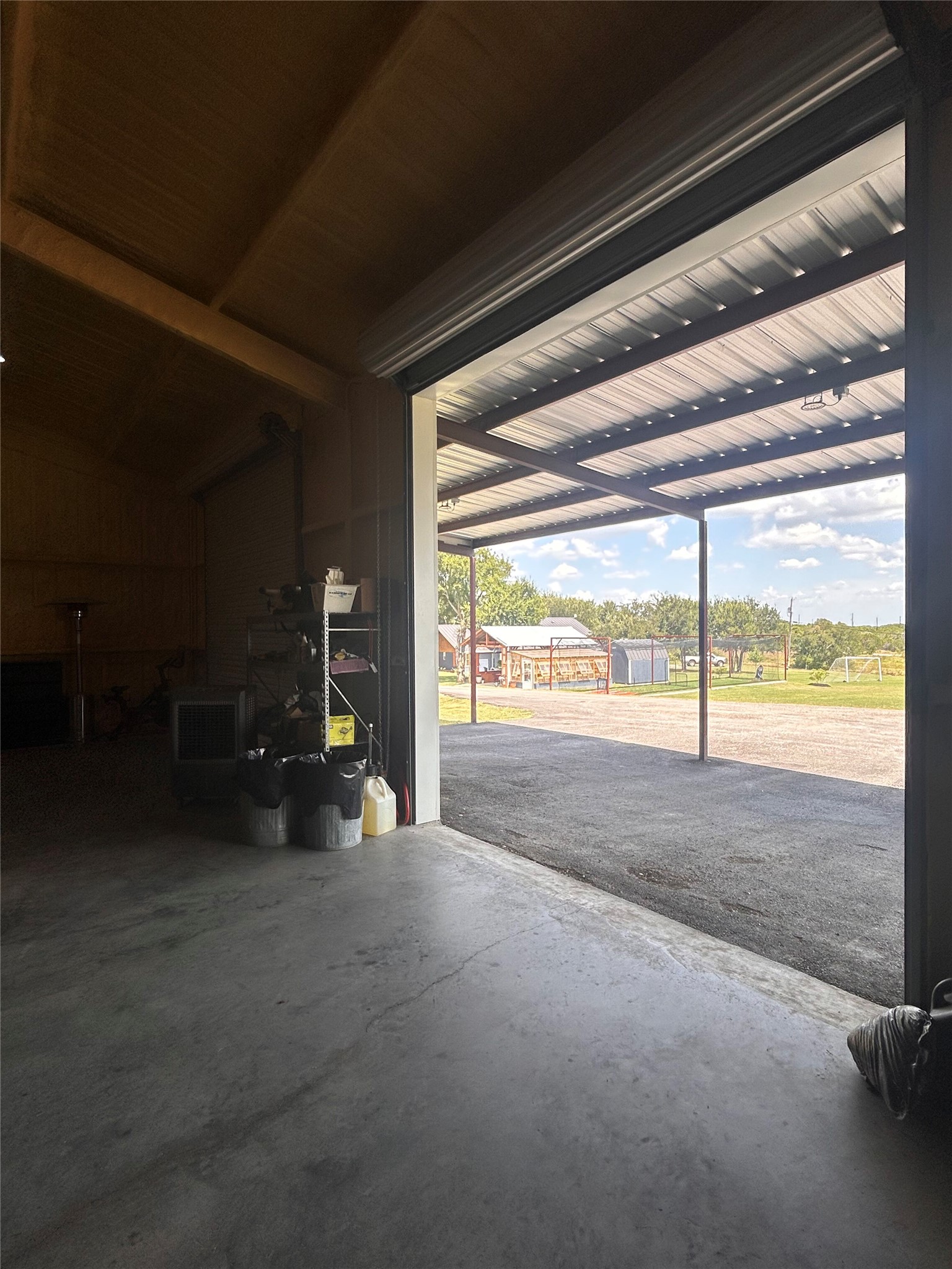 3001 County Road 255 Georgetown, TX 78633 - Photo 32 of 35 Three wide rollup doors give full access to the workshop and make it completely flexible for anything you wish to do.