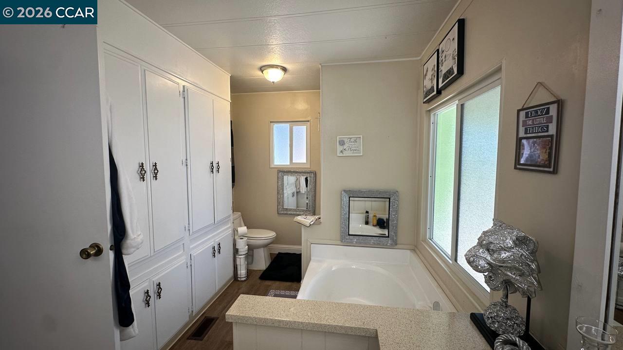 367 Ravine Circle Rancho Cordova, CA 95670 - Photo 17 of 21 a spacious bathroom with a tub and shower