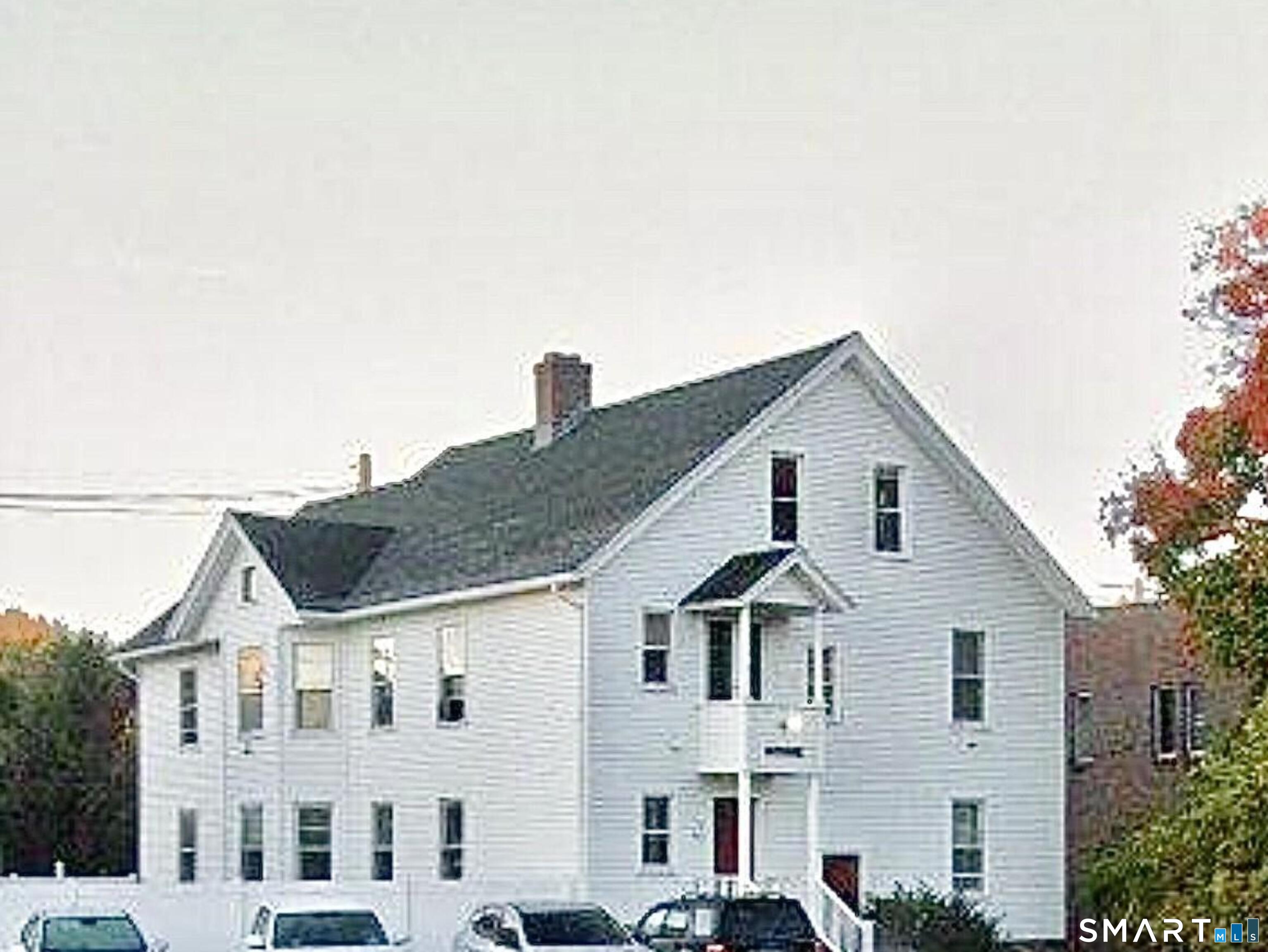 81 School Street Bristol, CT 06010 - Photo 2 of 2 a view of a white house next to a yard