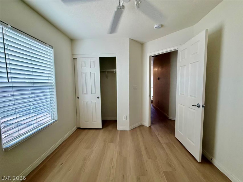 11183 Ranch Valley Street Las Vegas, NV 89179 - Photo 14 of 19 A well-lit bedroom with modern flooring offers a comfortable living space.