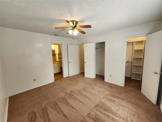 a bathroom with a sink a toilet a mirror and shower