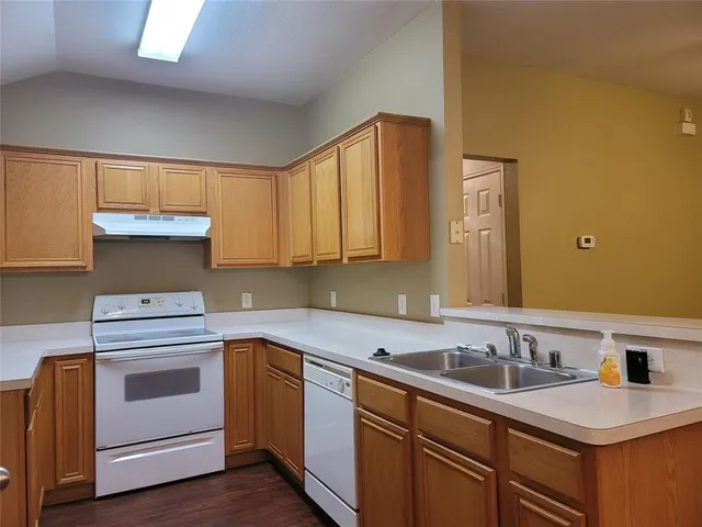 a view of an empty room and a ceiling fan
