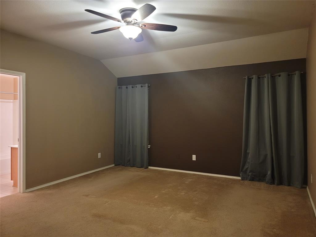 204 Meadow View Lane Anna, TX 75409 - Photo 17 of 23 a view of an empty room with a ceiling fan