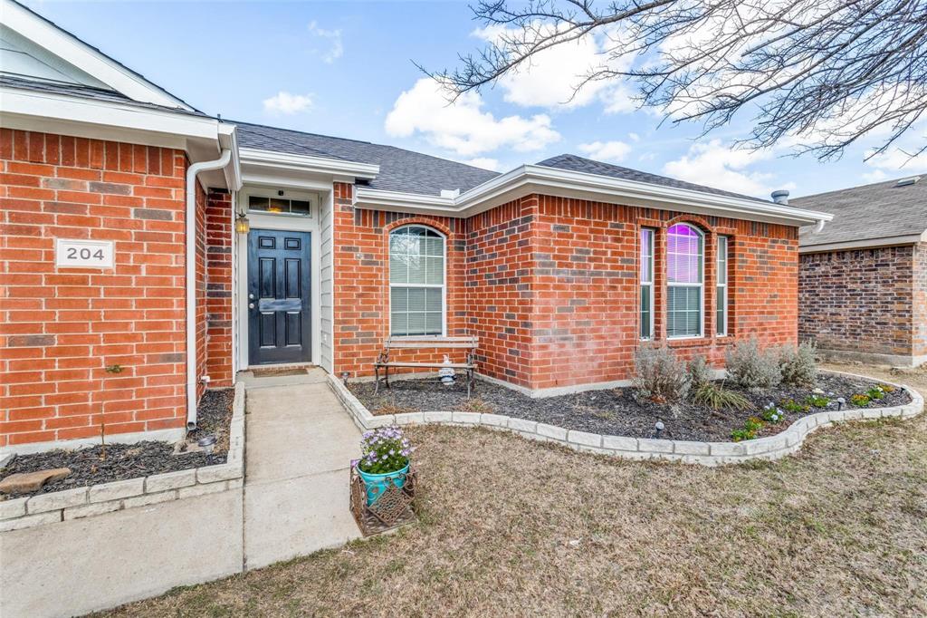 204 Meadow View Lane Anna, TX 75409 - Photo 2 of 23 a front view of a house with garden