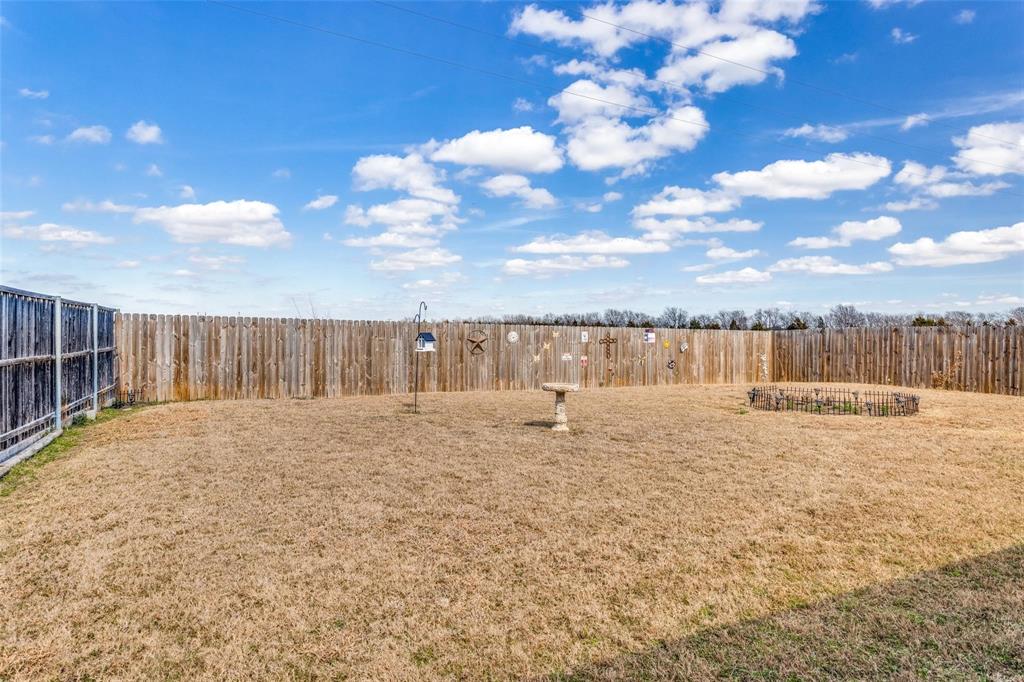 204 Meadow View Lane Anna, TX 75409 - Photo 21 of 23 a view of a dry yard with wooden fence