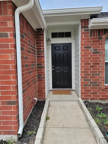 a view of front door of house with stairs
