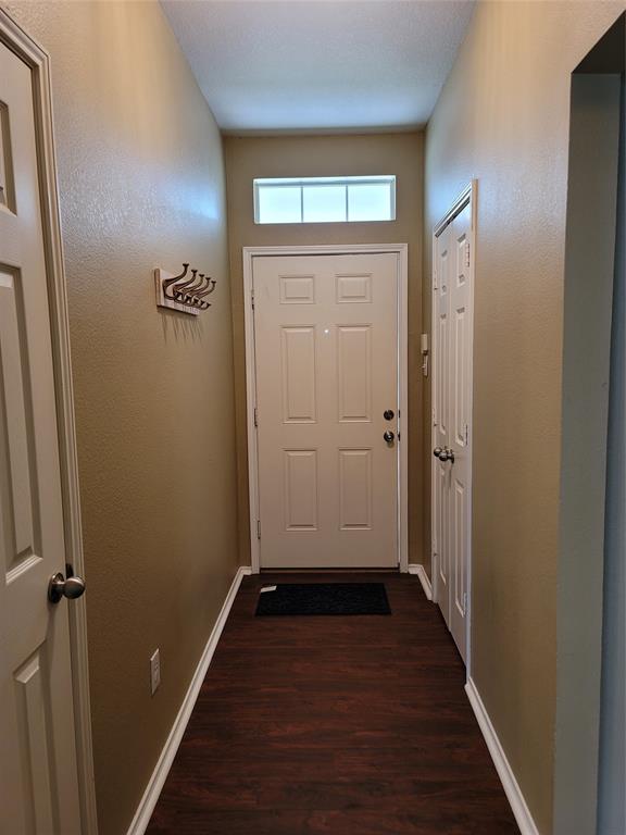 204 Meadow View Lane Anna, TX 75409 - Photo 4 of 23 an empty room with wooden floor closet and windows