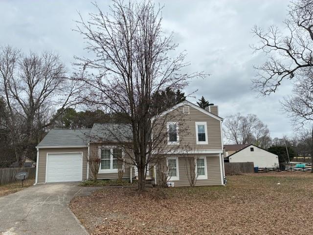 front view of a house with a dry trees