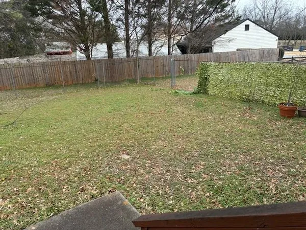 a view of a yard with a house