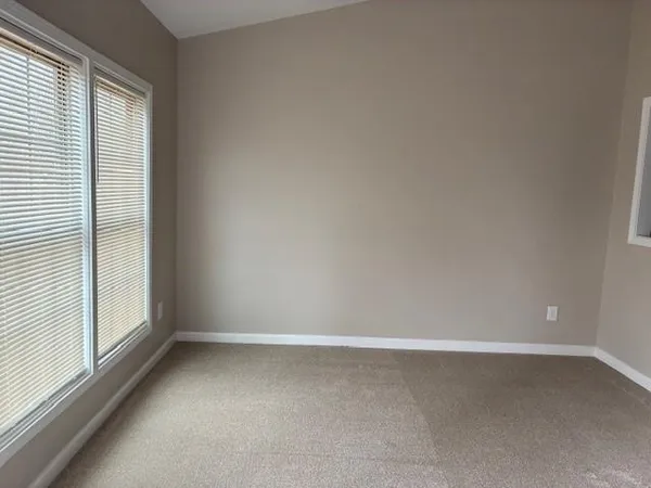an empty room with a fireplace