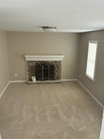an empty room with windows and entrance