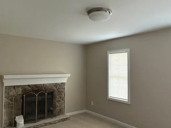 a view of a bathroom with a sink and a mirror