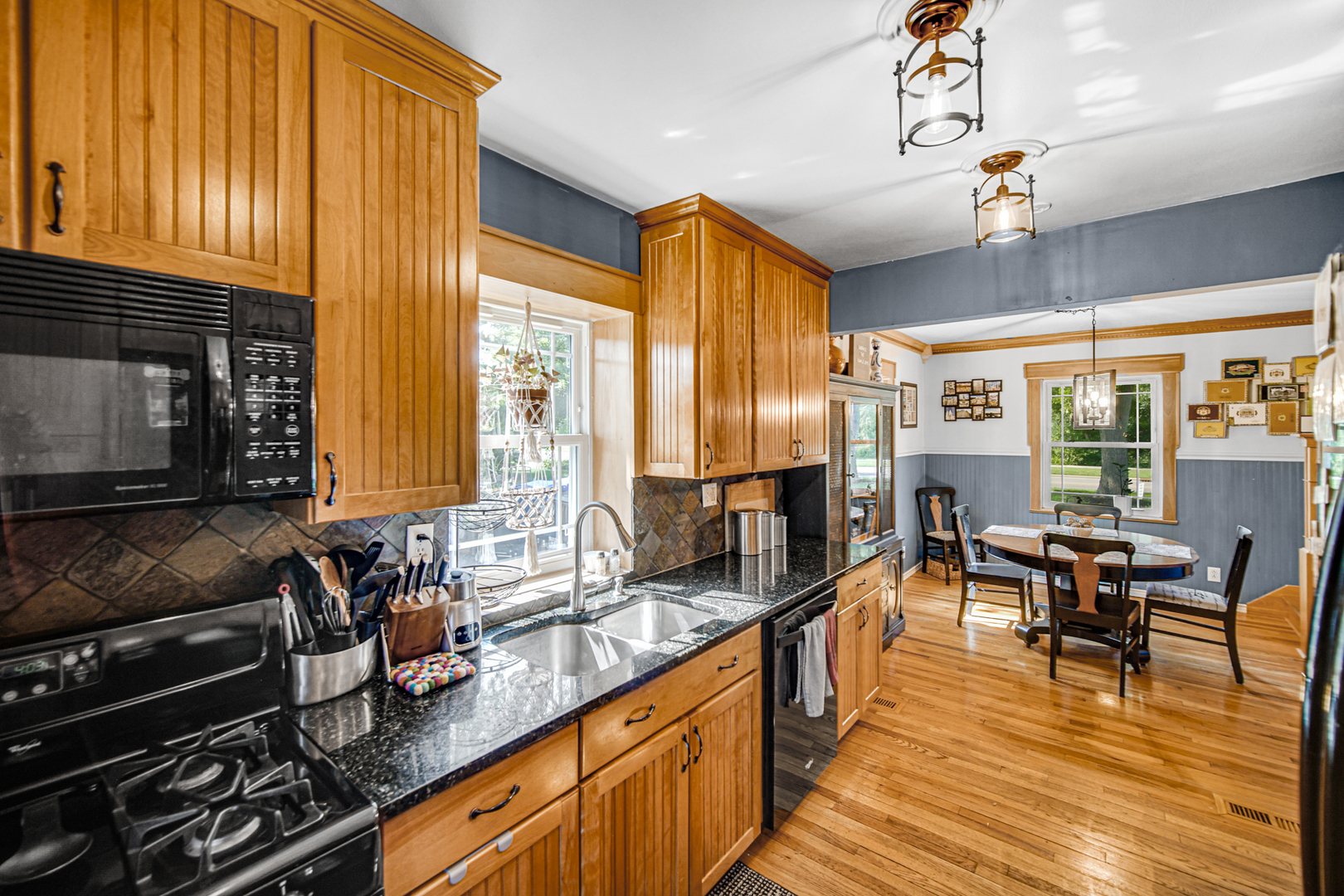 1308 Manchester Road Wheaton, IL 60187 - Photo 11 of 30 a kitchen with sink refrigerator and large window