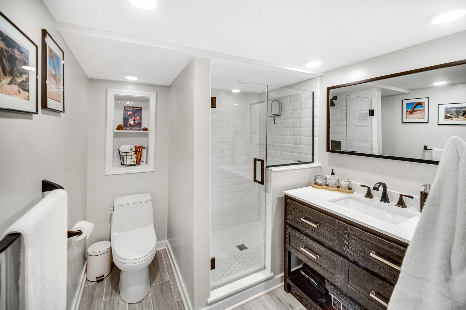 1308 Manchester Road Wheaton, IL 60187 - Photo 18 of 30 a bathroom with a double vanity sink toilet and shower