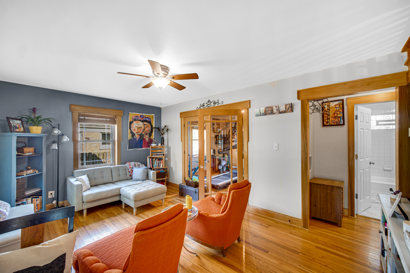 1308 Manchester Road Wheaton, IL 60187 - Photo 7 of 30 a living room with furniture a ceiling fan and a window