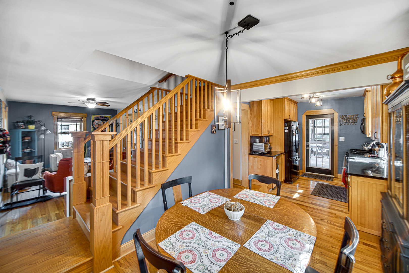 1308 Manchester Road Wheaton, IL 60187 - Photo 9 of 30 a view of a livingroom with furniture hardwood floor and a ceiling fan