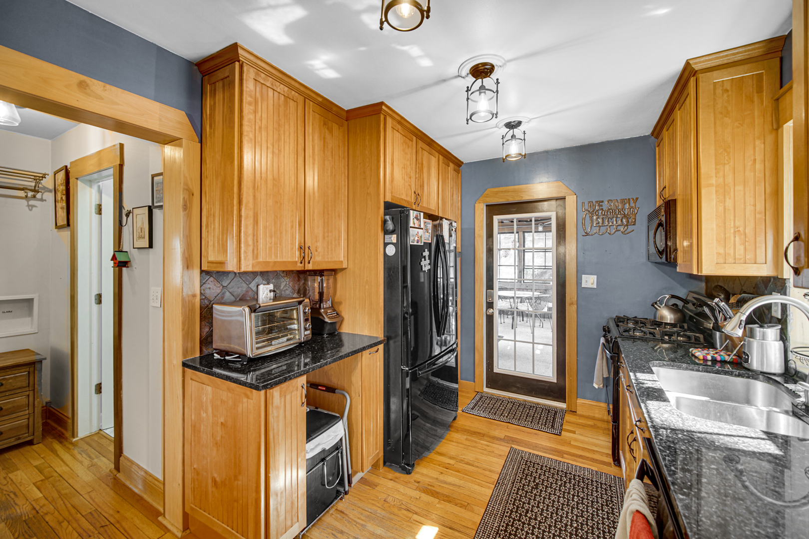 1308 Manchester Road Wheaton, IL 60187 - Photo 10 of 30 a kitchen that has a lot of furniture a refrigerator and a sink