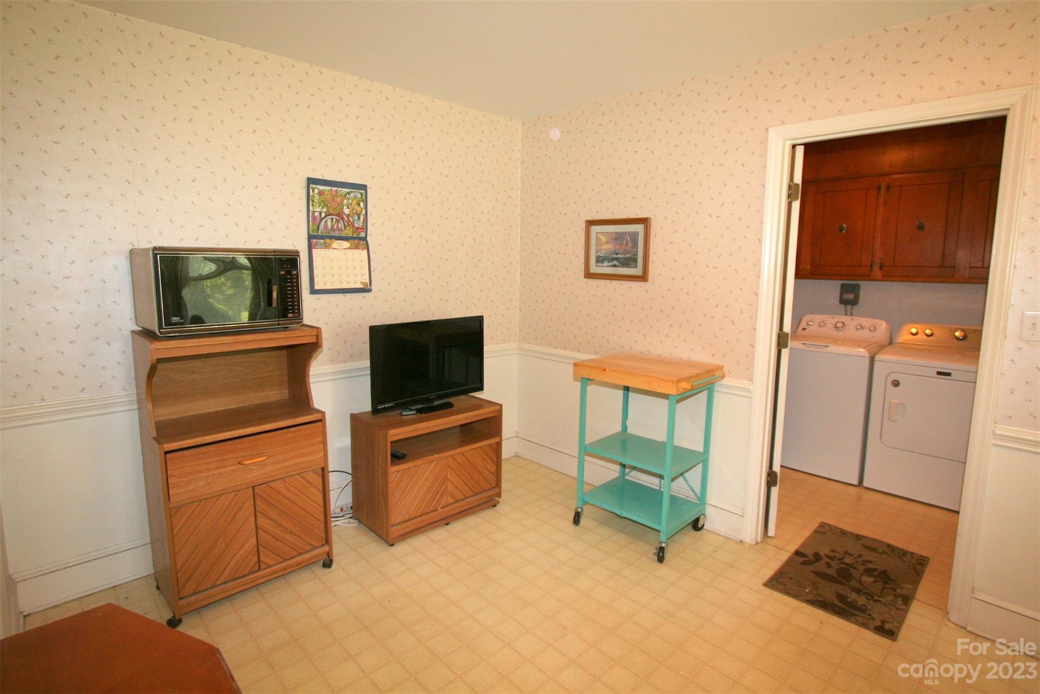 2813 Castlebrook Drive Monroe, NC 28112 - Photo 12 of 37 a living room with furniture and a flat screen tv